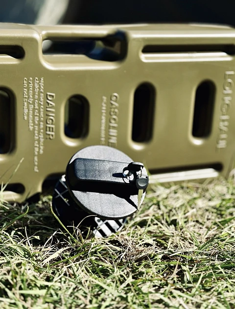 Close-up of the locking cap and spout on a heavy-duty jerry can